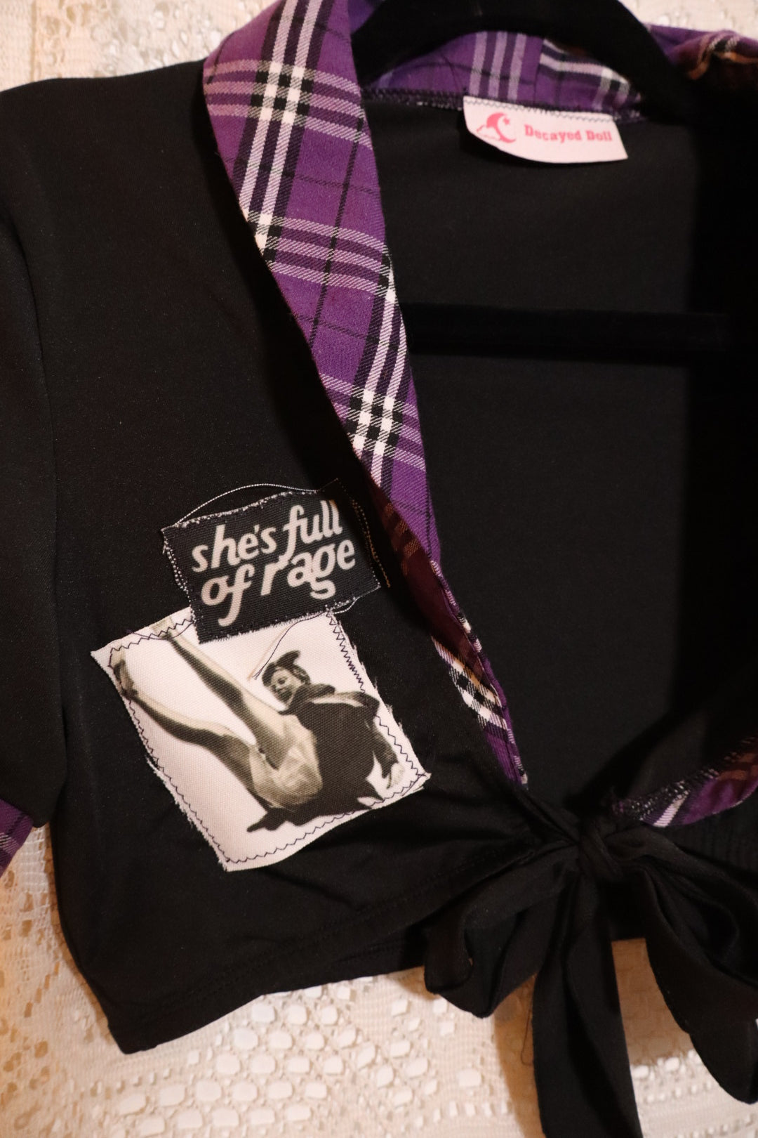 She’s full of Rage plaid tie top