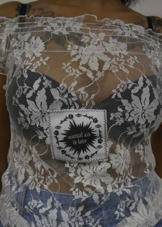 Mutual aid is love white lace top