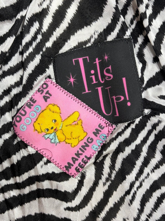 Tits up!